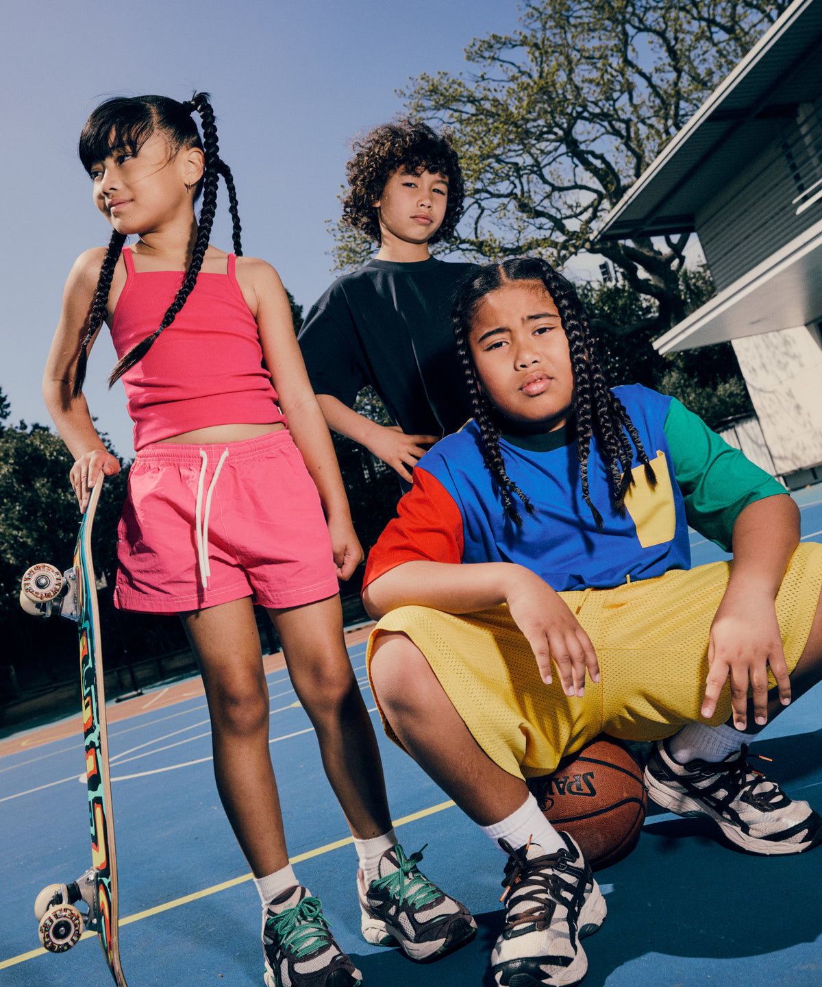 SONNIE Colour Block Pocket Tee in Team Red, Cobalt Blue, Sunshine Yellow, Ink and Varsity Green, worn